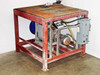 Rear three-quarter view of platform skid showing Alfa Laval pump, hoses, motor starter, and diamond plate top with surface rust