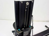 Richards B17266 vertical carriage closeup – belt-and-chain drive on vertical column with adjustment knobs and teal locking hardware