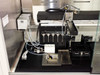 Symyx Technologies S14100 Crystallizer CE – interior close-up showing robotic arm assembly, Kloehn fluid delivery system, and tray positions