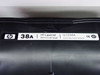 HP 38A LaserJet print cartridge Q1338A label detail — installed cartridge visible