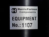 Harris/Farinon Components Equipment No. 1107 — close-up of aluminum identification label on black body