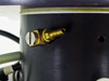 Harris/Farinon 1107 — close-up of brass barb fitting on side of black cylindrical body, part of heating/cooling jacket circuit