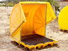 Eagle 1646RTC containment unit open at an angle — showing interior grated floor, curved yellow walls, and metal handle brace