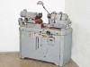 Autoflow Engineering 3173 lens polishing lathe — front-right three-quarter view showing overall machine profile and cabinet