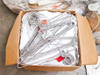 Cardboard box filled with wire metal garment hangers and white cleanroom tops