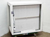 Vari-Speed laminar flow hood rear view showing HEPA filter frame, fluorescent light fixture trough with bare wiring, and caster base