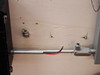 Conduit and wiring detail – aluminum conduit with black and red conductors routed between enclosure and Bonitron regen unit on cart