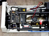 Interior of Spectra-Physics 2020-11 laser head showing plasma tube, high voltage components, steering mirrors, and cooling fan assembly