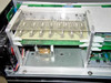 Interior of Spectra-Physics 2560 power supply showing control board assembly with slide potentiometers and green PCBs on upper chassis