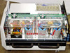 Interior of Spectra-Physics 2560 power supply showing dual high-voltage capacitor banks with DANGER HIGH VOLTAGE label, transformers, and PCBs
