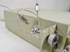 LDC ConstaMetric III G left side view showing stainless steel inlet/outlet fittings, inline filter or check valve assembly, and tubing routing with blue connector