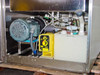 ITS UC-7010 internal lower cabinet overview showing Dayton pump motor, LMI chemical pump, 3-gallon reservoir, and plumbing manifold