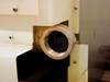ITS UC-7010 lower base showing large-diameter threaded drain or process connection port on polymer enclosure