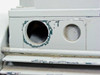 Bell & Gossett FST 3000 pump base — close-up of mounting foot showing significant paint chipping and surface corrosion around port openings
