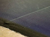 Close-up of Uni-Solar PVL-136 panel edge and cell surface showing thin-film amorphous silicon texture and black border trim