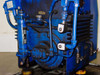 Tuthill KTC112 vacuum pump right-side view showing oil pump assembly, piping network, solenoid valve, and anti-vibration mounts