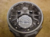 Top-down view of Liberty Pumps P382LE41 basin lid assembly showing dark lid with central access plug, two pump cord knockouts, and attached nameplate
