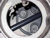 Interior view through lid access port showing molded pump mounting pads inside empty basin — no pump installed