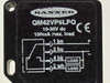 Banner QM42VP6LPQ photoelectric sensor — top label close-up showing model, 10-30V DC, 100mA max load rating, and wiring diagram with pin assignments