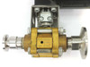 Swagelok B-63TUVF8R brass valve close-up showing body markings, BRASS material stamp, and sanitary tri-clamp end connections