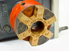 Close-up of Lovejoy L-090-C95 brass spider coupling hub mounted on Boston Gear 713A-40J indexing drive output shaft