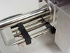 Close-up of PGT PRISM60 motorized stage stainless steel rails, lead screw, and wiring harness with red paper tag visible