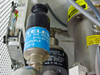 Televac thermocouple gauge sensor installed on TPH 050 system with high-voltage warning label visible
