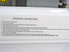 Operating instructions label on unit showing 10-step procedure for connecting and operating the vacuum pump system