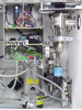 Close-up interior view of TPH 050 turbo molecular pump with control wiring, relay board, and Televac thermocouple gauge