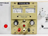 Lambda LP-411A-FM-W focusing power supply module close-up — showing DC Volts and DC Amperes analog meters, MODELE LP-411A-FM-W label, Sortie 0-20V, I MAX 1.08A, REGL TENSION and REGL COURANT knobs