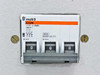 Merlin Gerin Multi9 C32N three-pole circuit breaker closeup showing n°35, U(32A), 380V, 8000A IEC P1, part number 85 23 E, all poles in OFF position