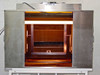 CRP L-207-B exposure chamber interior showing amber/orange fluorescent overhead lighting and adjustable plate holder frame — front open view