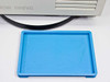 Tomy Seiko MTX-150 blue plastic condensate drip tray – shown removed and placed in front of centrifuge base