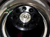 Tomy TMX-20 rotor close-up showing numbered tube positions (1–8) and center hub with Tomy Seiko markings