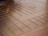 Macro close-up of Villa Precision GS-210 scribed glass substrate surface showing fine cross-hatch scribe lines in grid pattern