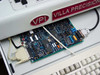 Close-up of Villa Precision VPI proprietary motion controller PCBs in machine drawer with DB-9 connector and ribbon cables