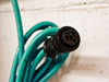 Close-up of multi-pin circular connector on teal cable attached to MTS Level Plus A910750172 transmitter