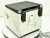 Tomy MCX-151 – rear view showing lid hinge mechanism, lid latches, and Tomy label on back panel