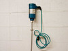 MTS Level Plus A910750172 transmitter head and upper rod section mounted to wall with coiled green cable