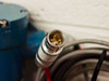 MTS A910410172 multi-pin circular locking connector on signal cable — gold pins visible