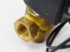 Parker 06F20C2114A3F4C80 solenoid valve – close-up of brass OUT port with threaded female connection and OUT marking cast into body