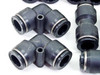 Additional black SMC 90-degree elbow fittings close-up showing collet ring and body markings