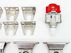 Eight stainless steel U-channel cylinder mounting brackets arranged in two rows, SMC VHS30-03 lockout valve with red handle and SUP label at right