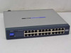 Linksys SR224 24-Port 10/100 Switch — front and top three-quarter view showing front panel ports and Linksys logo