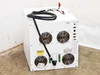 Dynatronix PMC 351/6-10-20XR — rear view showing four large cooling fans, green terminal blocks, caution label, and power cable exit