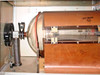 LFE PDS-501 plasma etch system — side view of barrel reactor chamber showing stainless steel end bell with bellows vacuum fitting and copper RF shielding enclosure