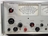 Singer Stoddart NM-37/57 EMI Field Intensity Meter – front panel closeup showing band selector (30–1000 MHz), bandwidth selector, attenuator knob, RF input, control mode, tune, fine tune, AFC, calibrate, and function knobs