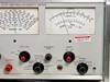 Singer Stoddart NM-37/57 – front panel closeup of frequency analog meter and microvolt meter with calibration sticker, showing fine tune, slideback peak, audio, function selector, and gain/power controls