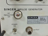 Singer 91263-1 Impulse Field Generator – close-up of front panel lower-left showing HV Regulator On indicator, Singer Electronic Products Division nameplate with model 91263-1 and serial number, Power On/Off toggle switch, and BNC output connector