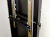 Detail view of 37U rackmount cabinet side rail showing adjustable sliding shelf bracket and door latch hardware